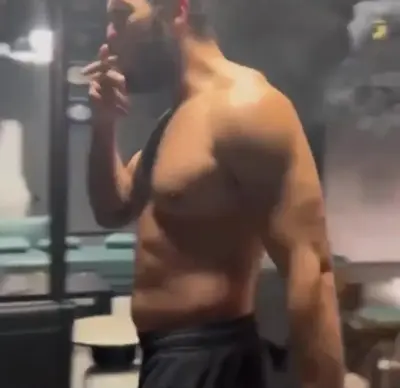 Andrew Tate smoking cigar meme template