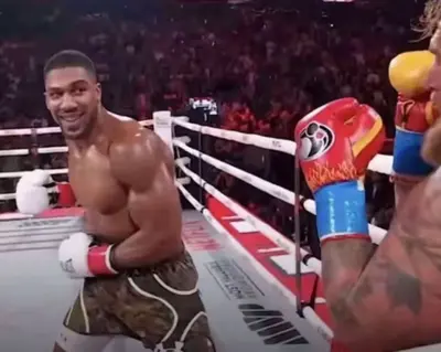 Anthony Joshua punching Jake Paul meme template