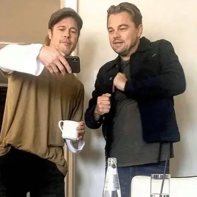 Brad Pitt showing Leo a meme meme template