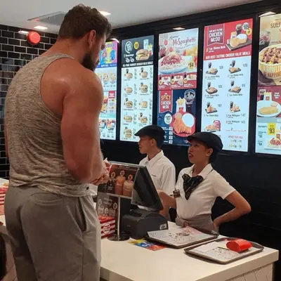 Buff guy ordering McDonalds meme template