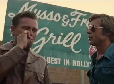 Leo crying on Brad Pitt's shoulder meme template