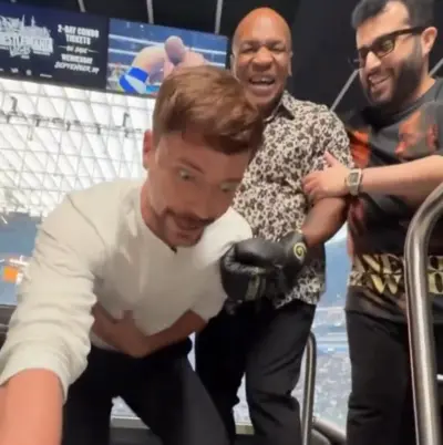 Mr. Beast getting punched by Mike Tyson meme template