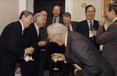 Reagan laughing with men meme template