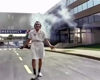 The Joker blowing up the hospital in The Dark Knight meme template